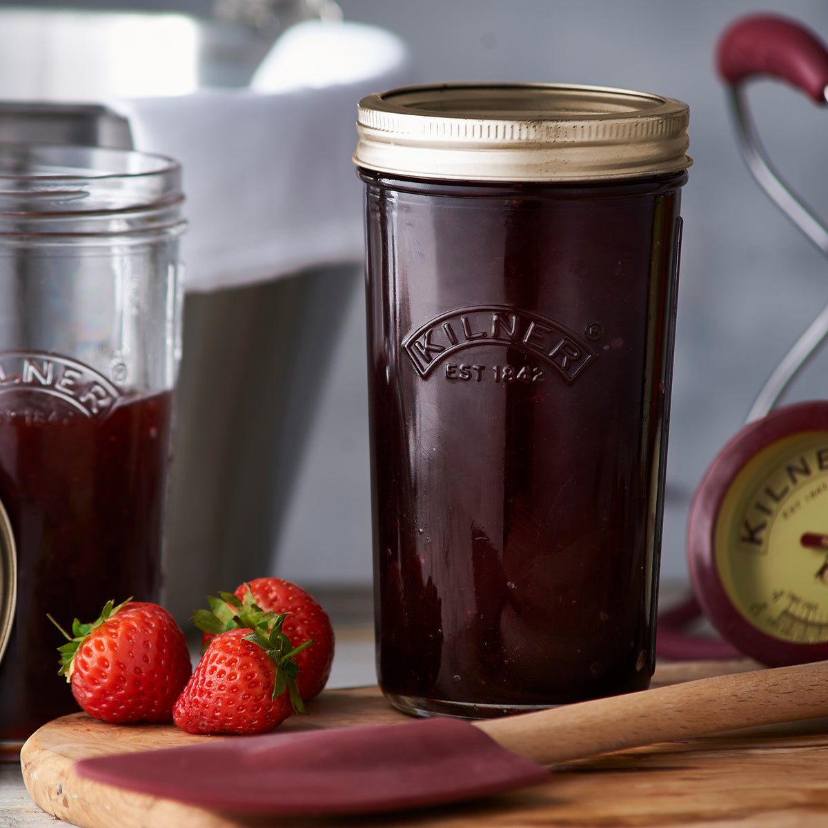 Clear KILNER Einkochglas with wide mouth, glass jar for preserving and canning, shown with transparent lid and smooth surface.