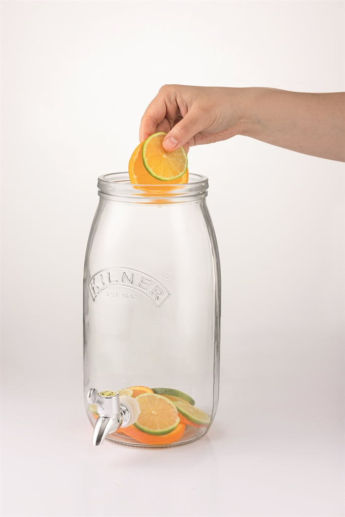 KILNER clear 3L drink dispenser made of glass with a spout for easy pouring, perfect for serving beverages at gatherings.
