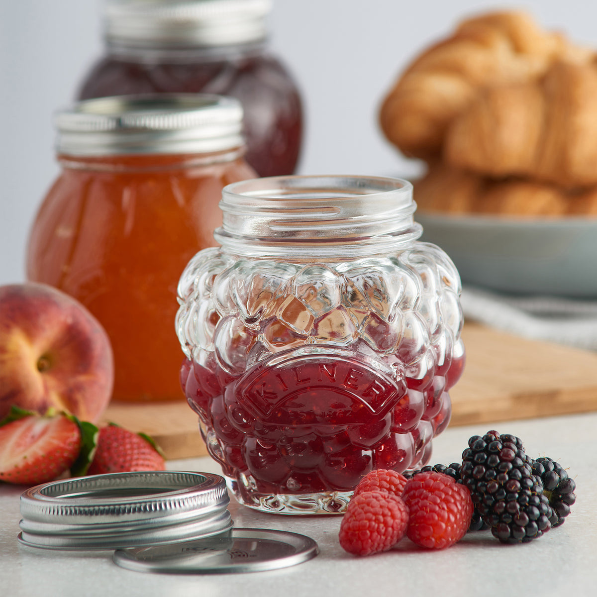 Clear KILNER marmalade jar with a metal lid, transparent glass container for preserving jams and spreads.