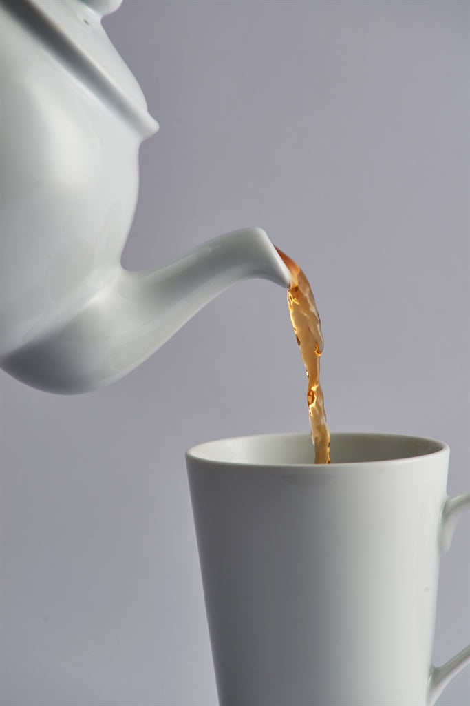 White P & K teapot with built-in infuser for brewing tea, shown with six matching cups in the image.