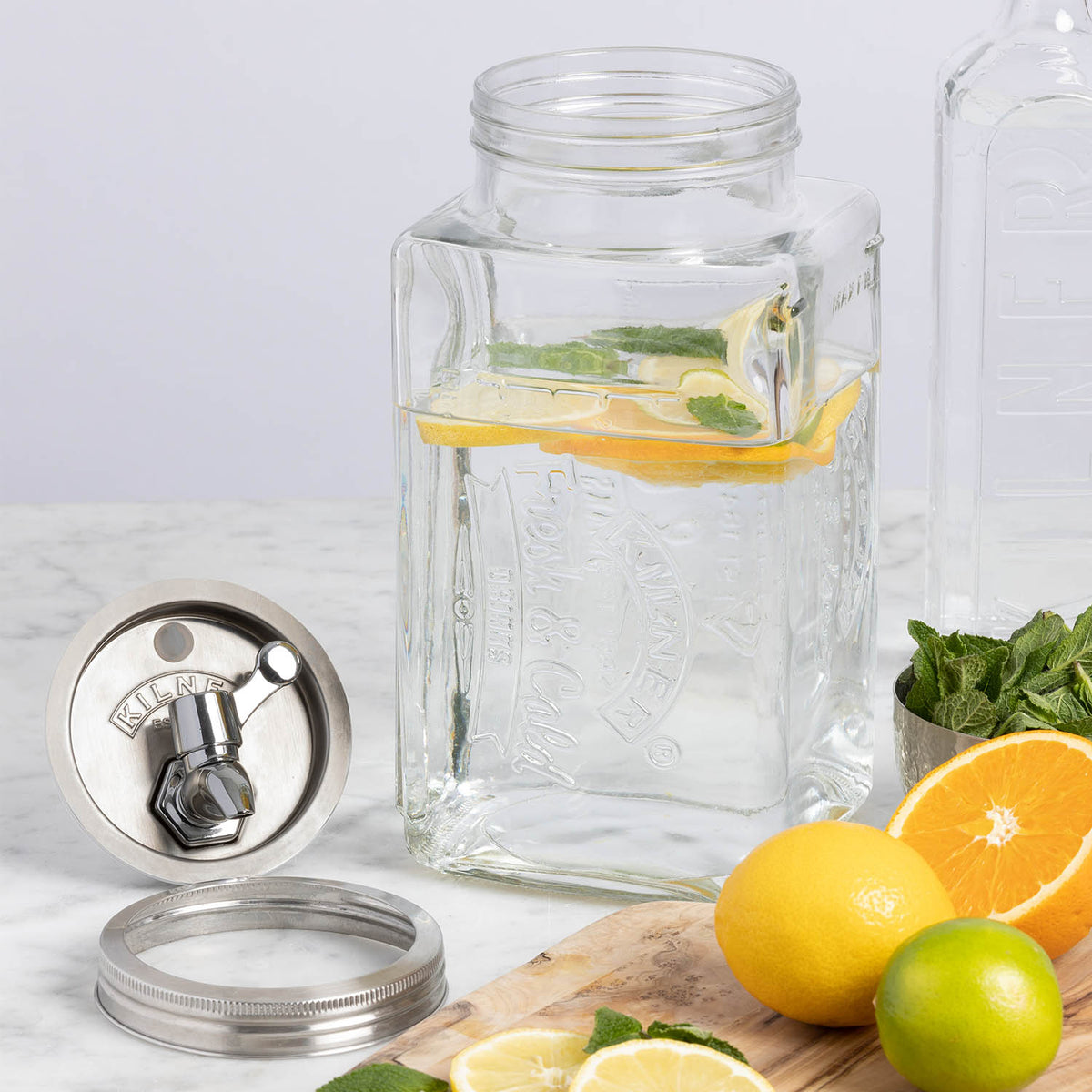 KILNER 3L clear glass drink dispenser with silver spigot, fridge-friendly beverage server for cold drinks.