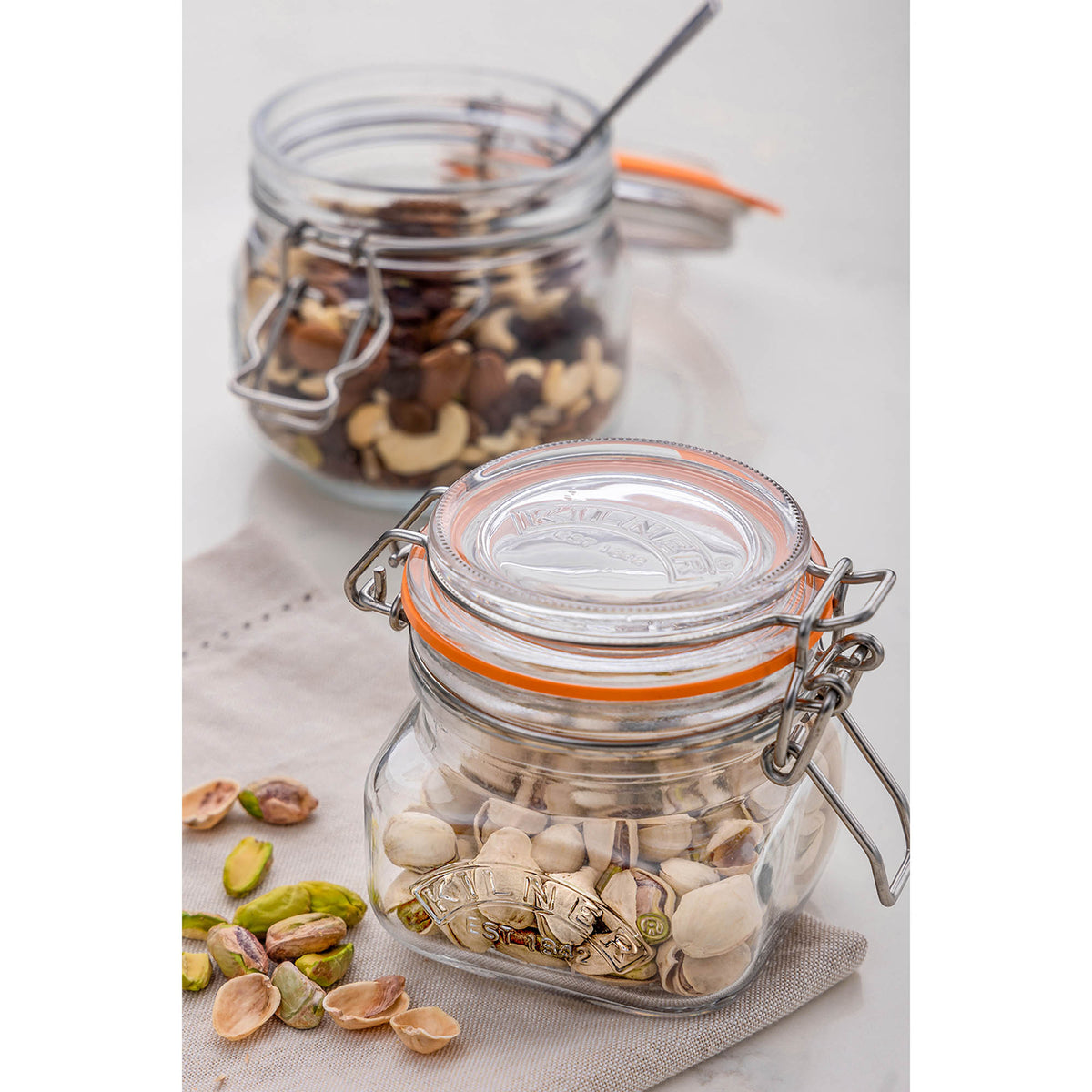 Clear KILNER Clip Square canning jar, glass storage container with metal clip lid, for preserving and storing food.