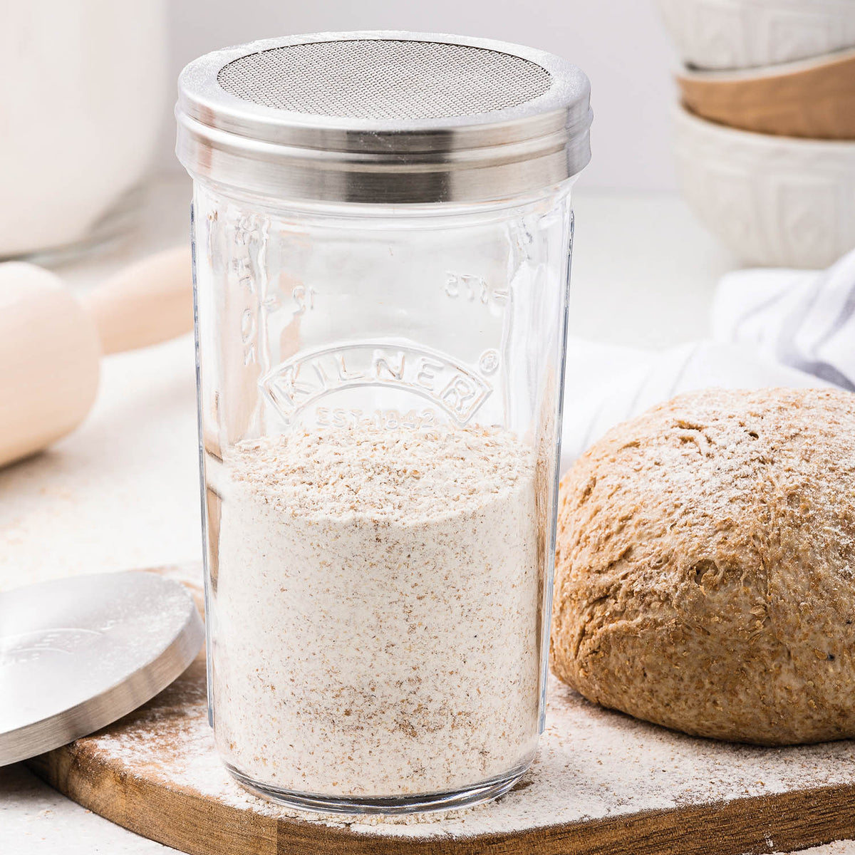 KILNER 0.5L square storage jar with sieve lid, clear glass, ideal for preserving and storing dry foods or liquids.