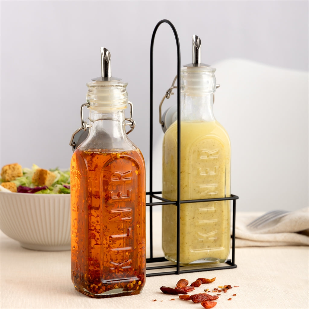 Clear KILNER oil and vinegar bottles with glass stoppers and elegant design, perfect for kitchen storage and serving.