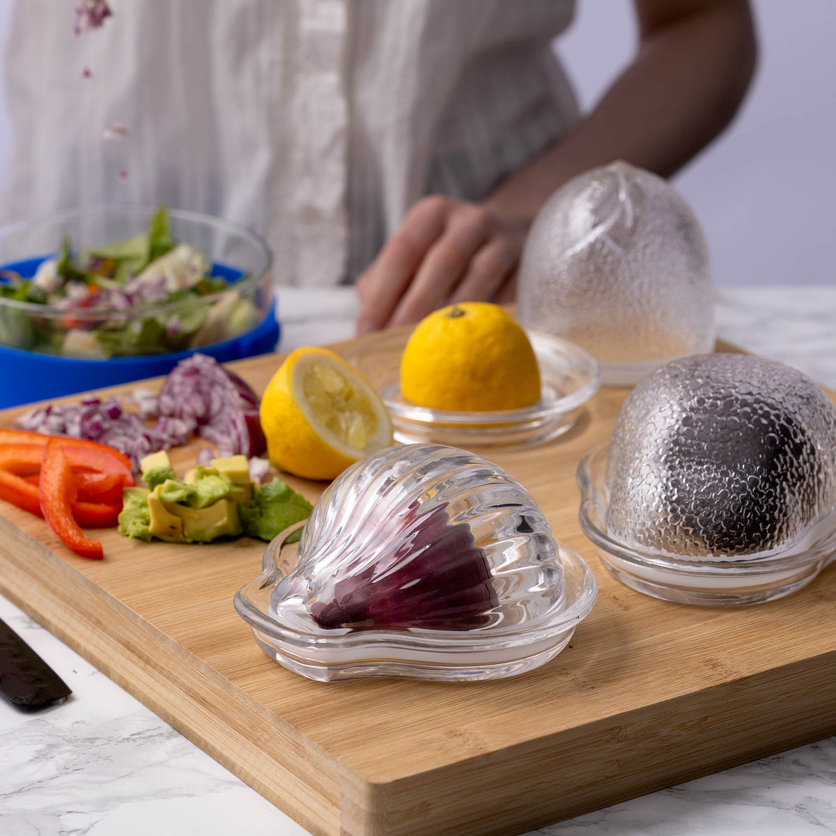 KILNER Onion Keeper clear food storage container for fresh onions, with a transparent design and secure lid.