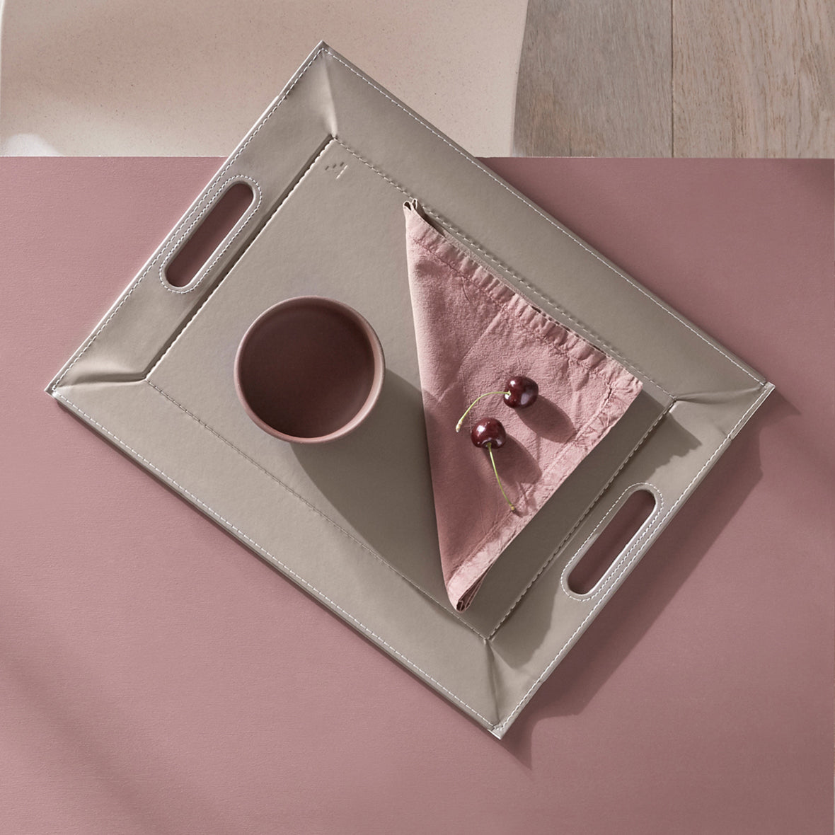 Freeform Duo tablet tray in white and taupe with a sleek, modern design, featuring two compartments for organizing essentials.