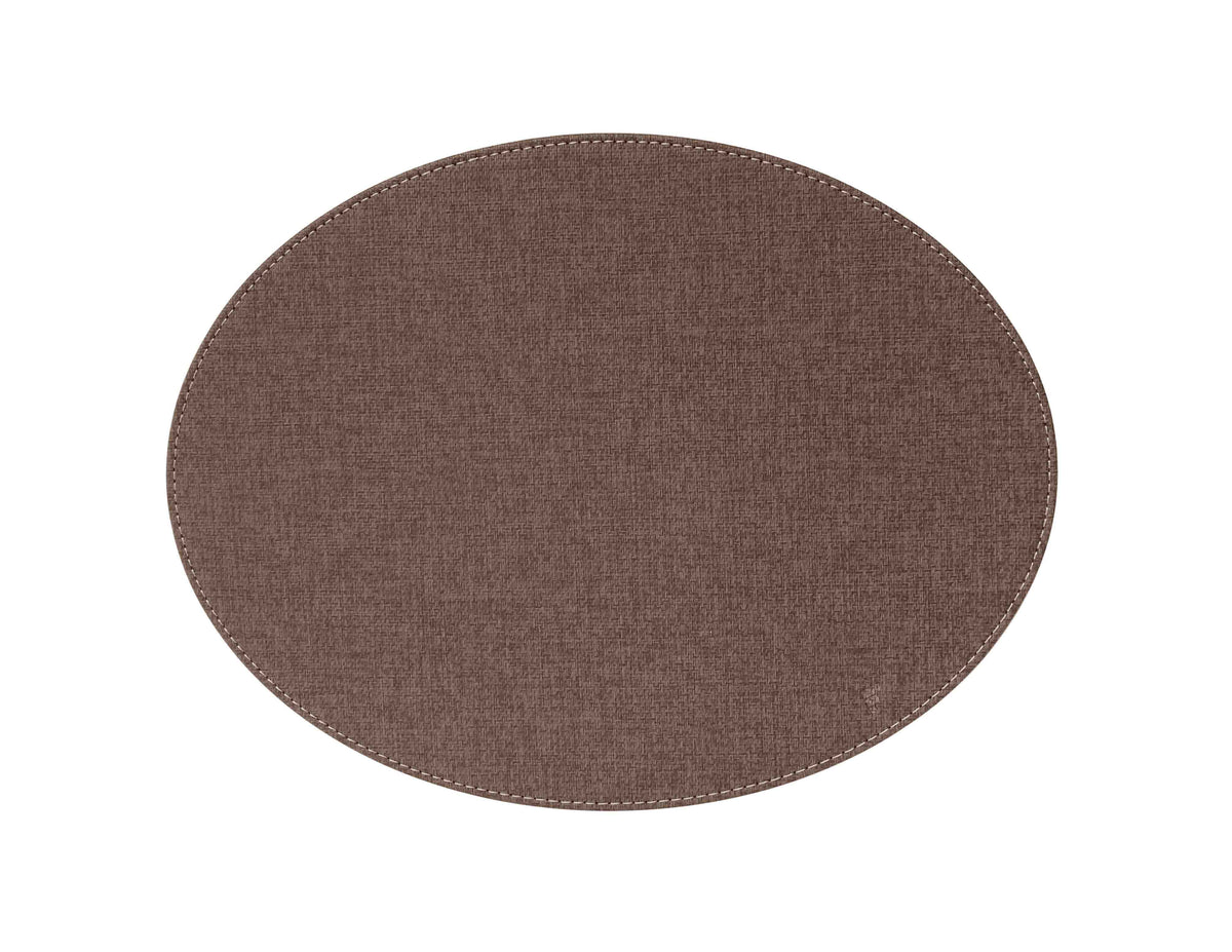Oval brown FREEFORM textile table setting with large matching placemats, showcasing a natural, textured fabric design.