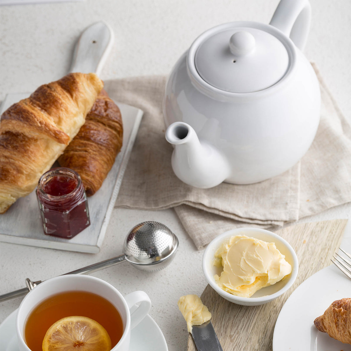 White P & K Kensington teapot with a classic design, featuring a smooth handle and spout, on a plain background.