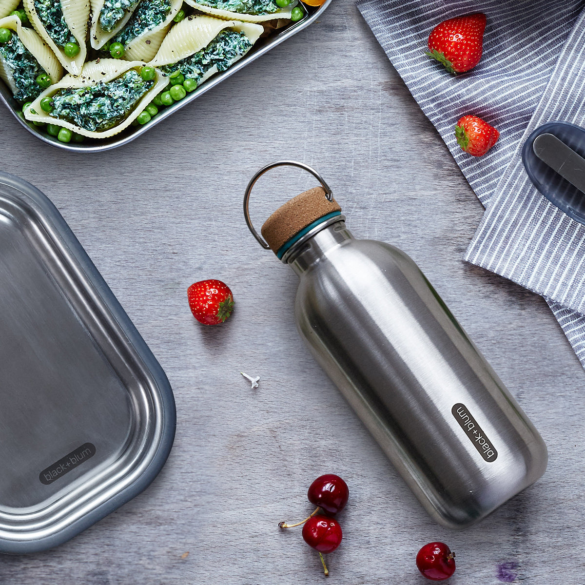 BLACK+BLUM Classic 600ml reusable water bottle with black cap and sleek design for daily hydration.