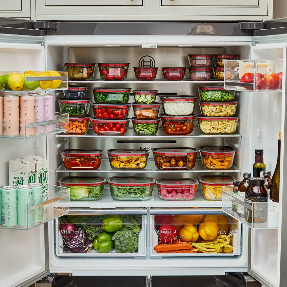 BLACK+BLUM glass multifunction storage containers, 4-piece set with secure lids, ideal for kitchen organization and food storage.