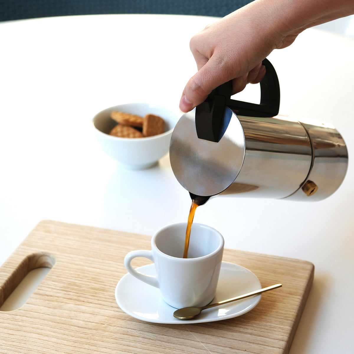 GNALI & ZANI Chicca espresso maker made of stainless steel, with a black handle and lid, compact design for stovetop brewing.