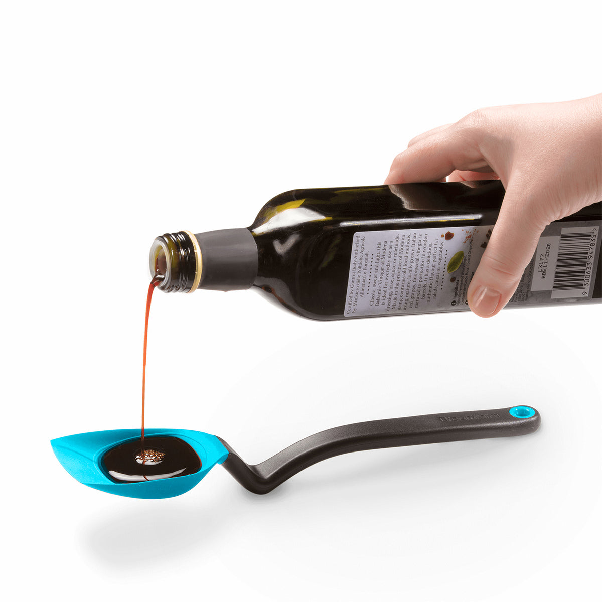 DREAMFARM 3-in-1 Kochlöffel (stirring spoon) with ergonomic handle and multiple functions for cooking and stirring.