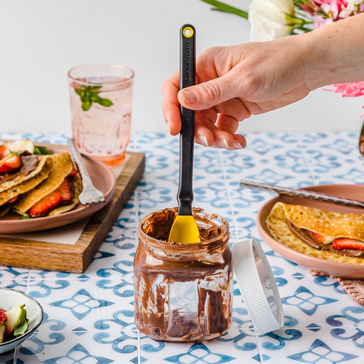 DREAMFARM MINI SUPOON cooking spoon with a sleek handle, ideal for stirring and serving in the kitchen.