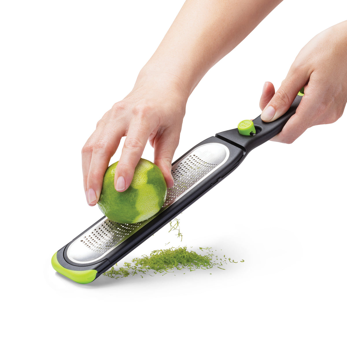 Green DREAMFARM Küchenreibe fein/konkav with a sleek design, perfect for grating spices and herbs in the kitchen.