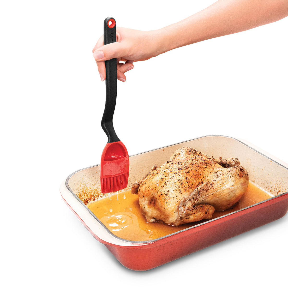 DREAMFARM Brizzle Kochpinsel with wooden handle and natural bristles for precise cooking and baking tasks.