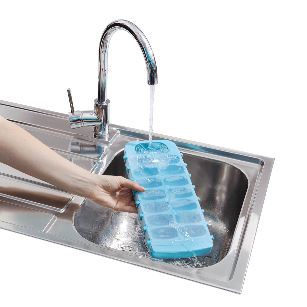 White DREAMFARM ice cube tray with multiple compartments for making ice cubes, featuring a sleek and practical design.
