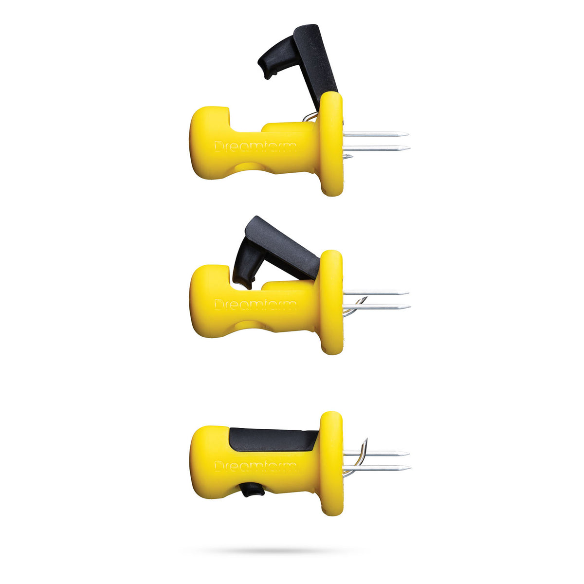 DREAMFARM yellow corn cob holder set with four clips, designed to hold corn cobs securely during eating.