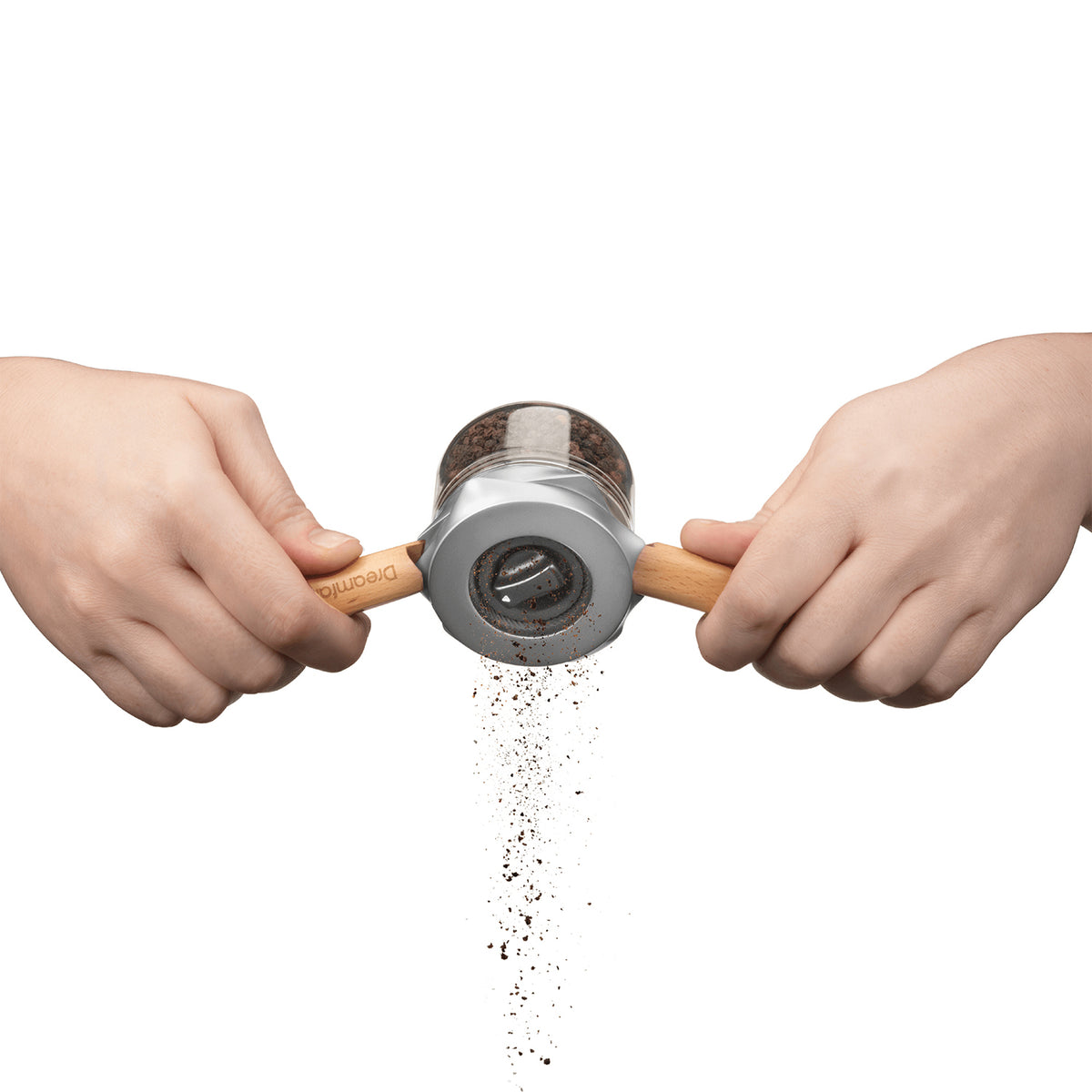 DREAMFARM ORTWO black spice grinder with a sleek design, showing the grinding mechanism and textured exterior.