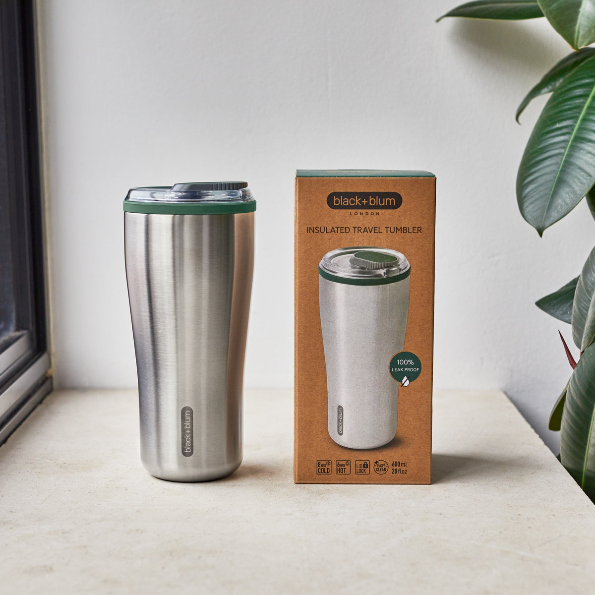 BLACK+BLUM insulated travel tumbler in black with ocean-themed packaging, designed for hot and cold beverages on the go.