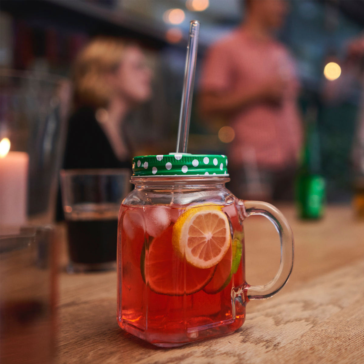 Set of four glass drinking straws in different sizes from Profino Select, showing clear, durable glass straws for beverages.