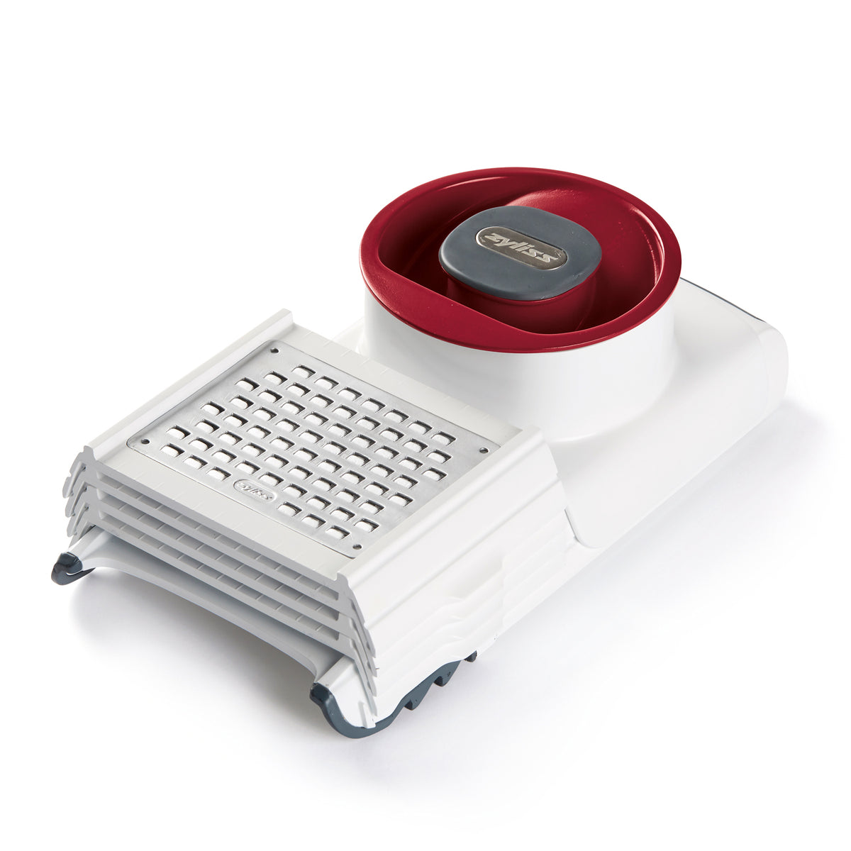 Zyliss 4-in-1 Hobel and Reibe with multiple blades for slicing, grating, and shredding in a compact kitchen tool.