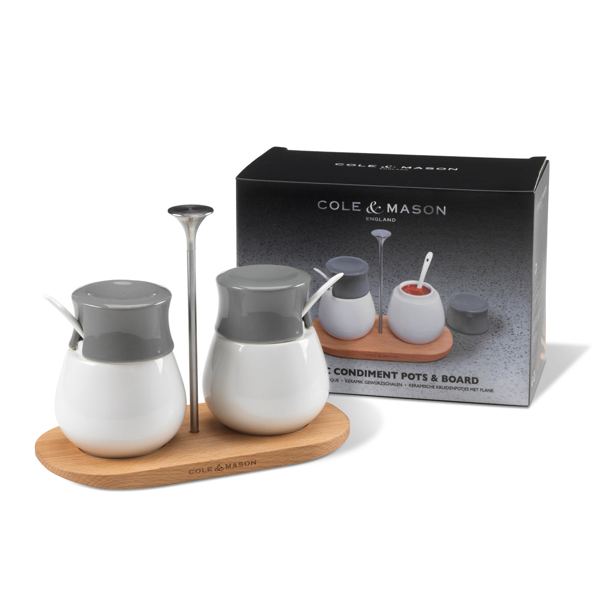 Set of two Cole & Mason spice shakers with a matching serving tray, featuring transparent containers with metal lids.