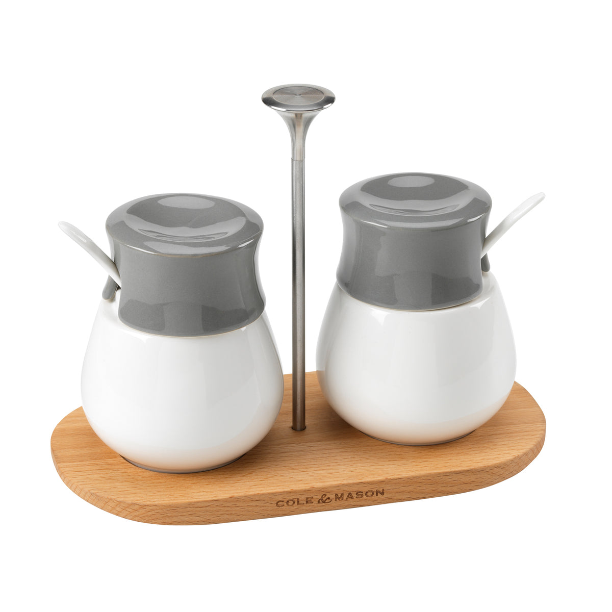Set of two Cole & Mason spice jars with a matching serving tray, featuring clear glass containers with black caps.