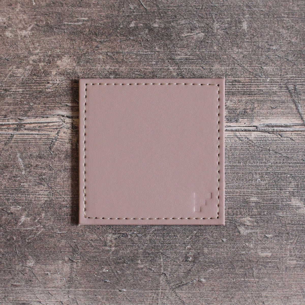 FREEFORM DUO coaster set with four round cork and silicone drink coasters for protecting surfaces.