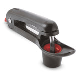 CUISIPRO cherry and olive pitter in black, with ergonomic handle and stainless steel parts for easy pitting of fruits and olives.