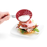 Red CUISIPRO egg poacher with four cups for making perfectly poached eggs in a non-stick design.
