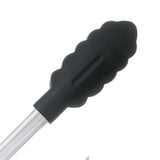 Black CUISIPRO cooking tongs with a stainless steel handle, designed for precise gripping during food preparation.