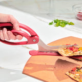 CUISIPRO pizza cutter in red with a round blade, designed for slicing pizzas easily and efficiently.