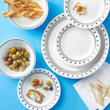 White CORELLE CITY BLOCK dishware set, including plates and bowls, arranged on a table for serving.