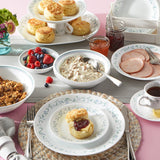 Corelle Country Cottage white dishware set with floral graphic design, showcasing plates and bowls for a charming kitchen look.