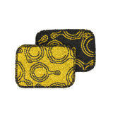 LODGE everyday scrub brush in black and yellow with sturdy bristles, designed for cleaning and scrubbing tasks.