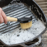 Brown LODGE brush with natural bristles, shown with close-up details of the wooden handle and bristle arrangement.