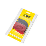 Lodge black and red grill scraper with a sturdy handle, designed for easy cleaning of barbecue grills.