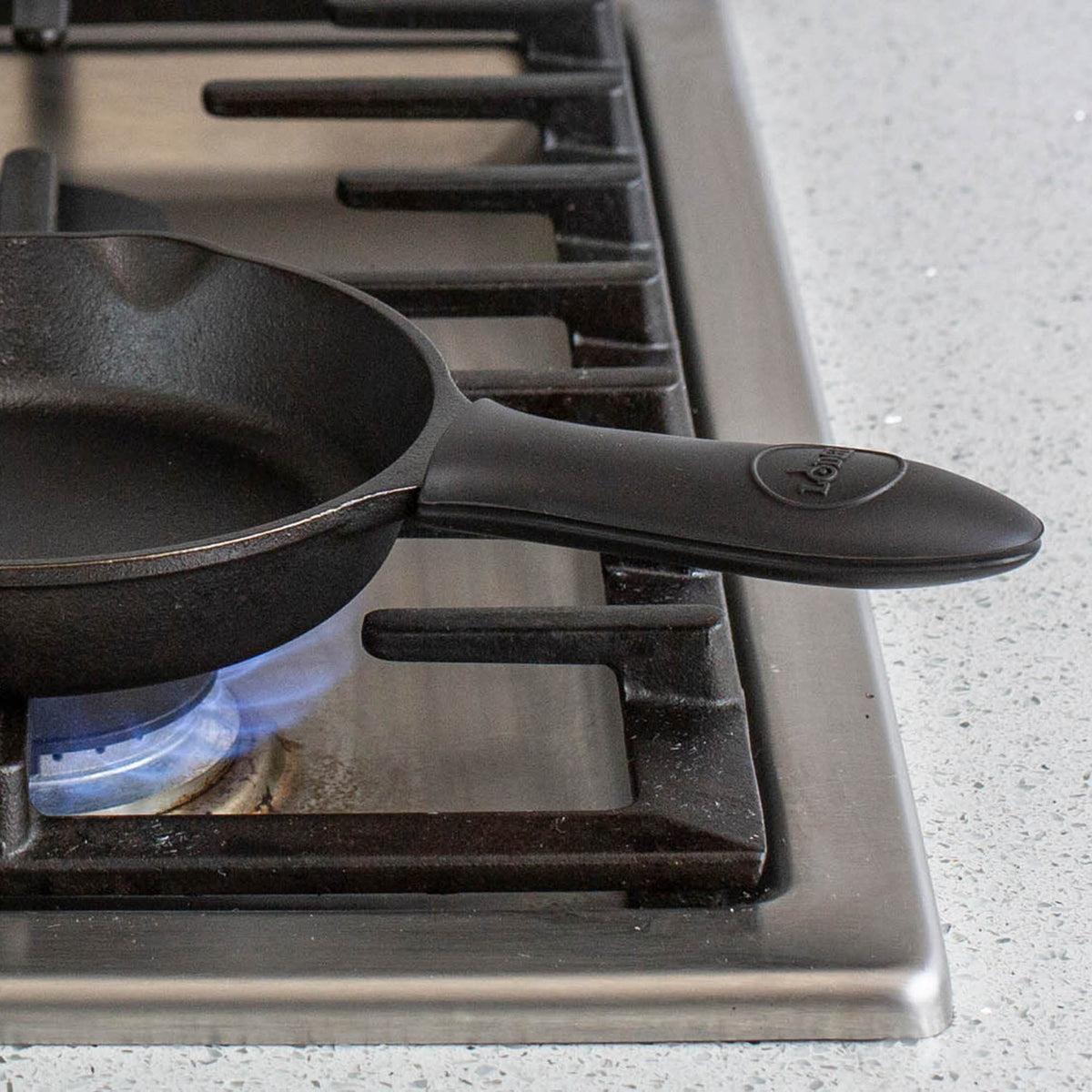 Black Lodge grip protector, a durable safety shield for kitchen utensils, designed to fit securely and prevent slips.