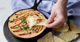 Lodge classic black cast iron skillet, sturdy cooking pan with a smooth surface and ergonomic handle for versatile use.