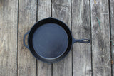 Black Lodge Classic cast iron skillet with handle, perfect for frying and cooking on stovetops or ovens.