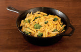 Lodge Classic black cast iron skillet, 25.4 cm diameter, with a handle and seasoned surface for versatile cooking.