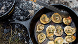 Black Lodge Classic cast iron skillet with handle, perfect for cooking and searing on stovetop or oven.