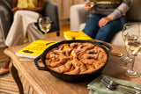 Lodge classic black cast iron skillet with handle, ideal for frying and searing food in the kitchen.