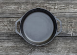 Lodge classic black cast iron skillet pan with handle, designed for versatile cooking and heat retention