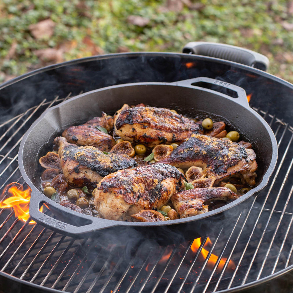 Lodge cast iron skillet in black, classic design, with a sturdy handle and seasoned surface for versatile cooking.