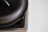 Black Lodge Classic lid for cookware, featuring a sturdy handle and snug fit, designed for optimal heat retention and easy handling.