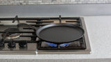 Lodge Classic black flat grill pan with a 26.7 cm diameter, suitable for outdoor or indoor grilling and searing.