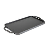 Lodge 2-sided grill plate with smooth and ridged surfaces, 50.8 cm x 25.4 cm, designed for versatile outdoor cooking.