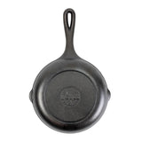 Lodge black cast iron skillet chef pan with handle, sturdy and seasoned for versatile cooking.