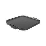 Lodge Classic black two-sided flat and ridged grill plate for outdoor cooking, featuring a durable cast iron surface.